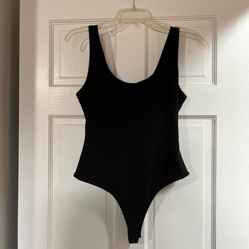 Solid black bodysuit